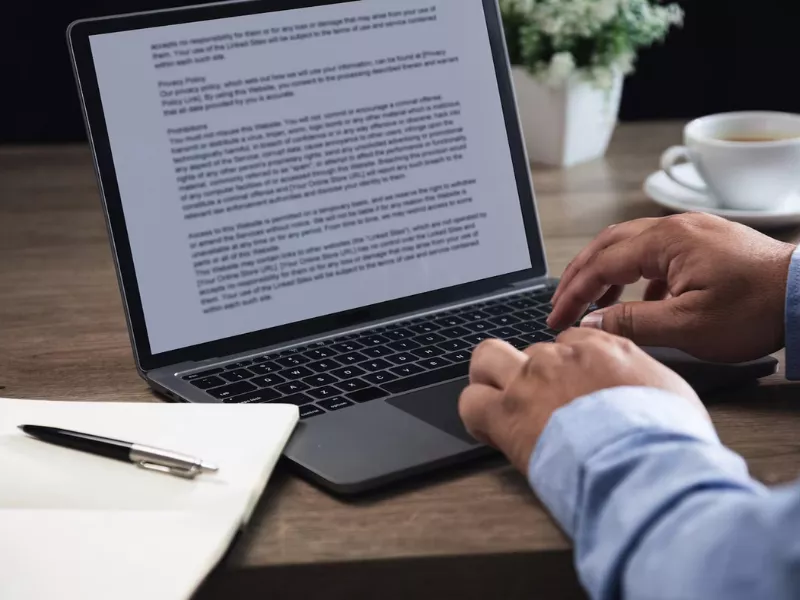 Professional reviewing guidelines on writing an AMA in-text citation on a laptop screen